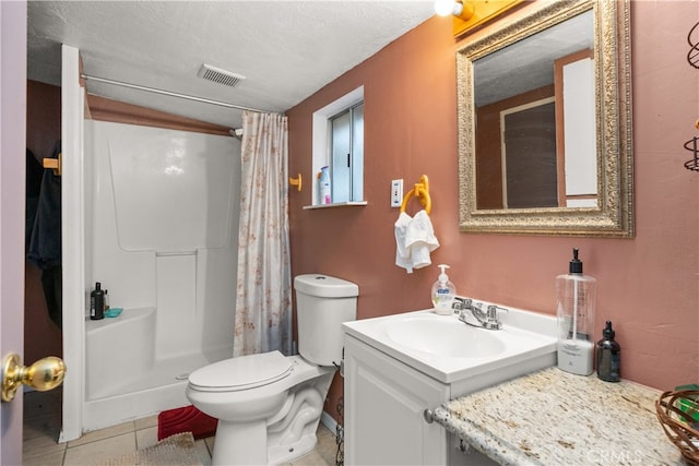 bathroom featuring vanity, a shower with curtain, tile patterned floors, and a textured ceiling