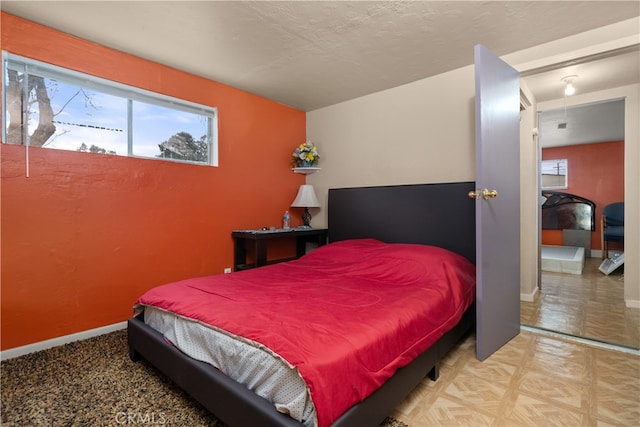 bedroom with light parquet floors