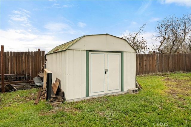 view of outbuilding with a yard