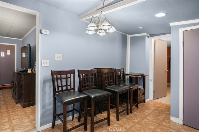 dining space with light parquet floors and an inviting chandelier