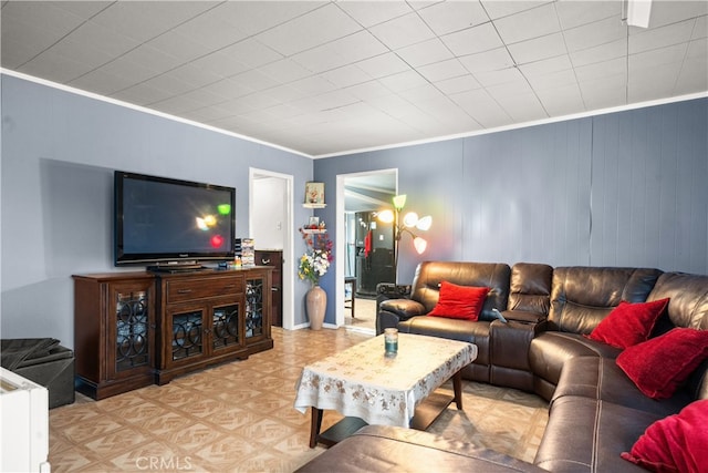 living room with ornamental molding and light parquet flooring