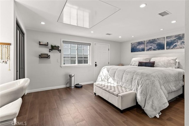 bedroom featuring dark hardwood / wood-style flooring