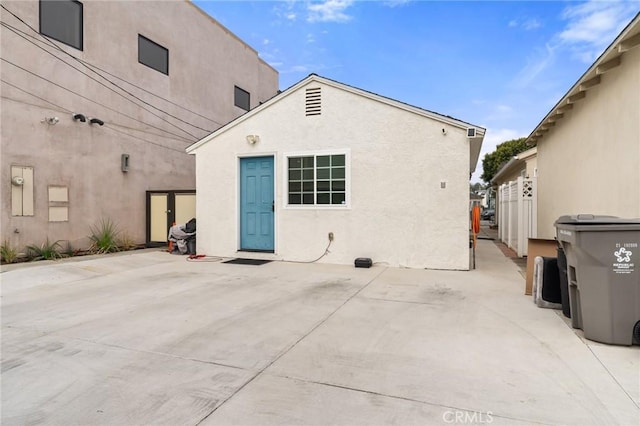 rear view of house featuring a patio