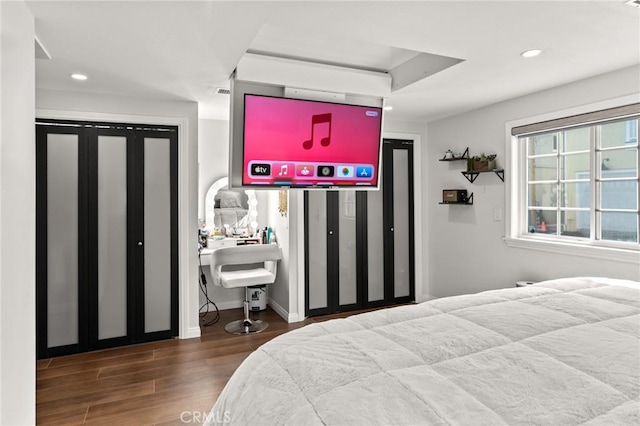 bedroom with wood-type flooring