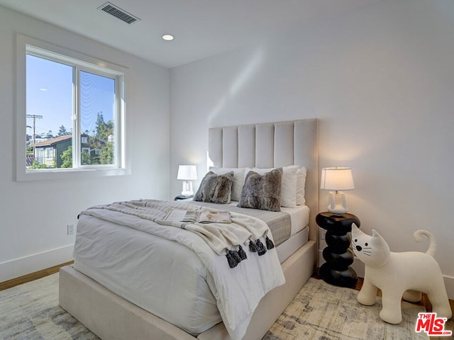 bedroom with light wood-type flooring