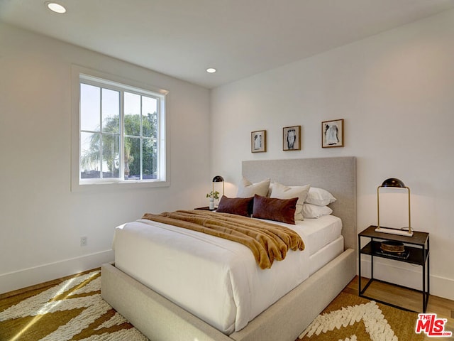 bedroom featuring hardwood / wood-style flooring