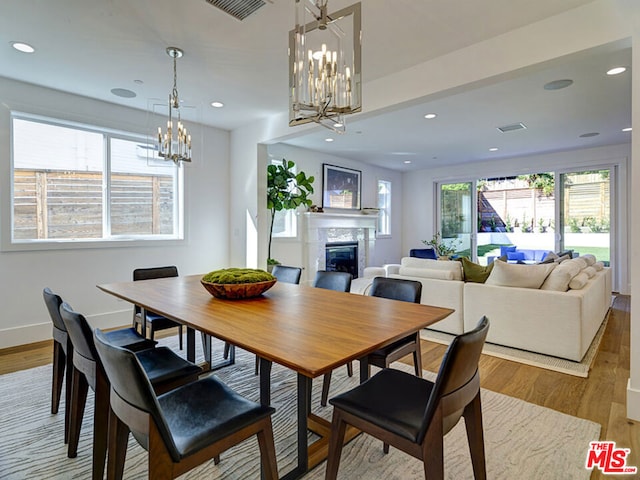 dining room featuring a chandelier and wood-type flooring