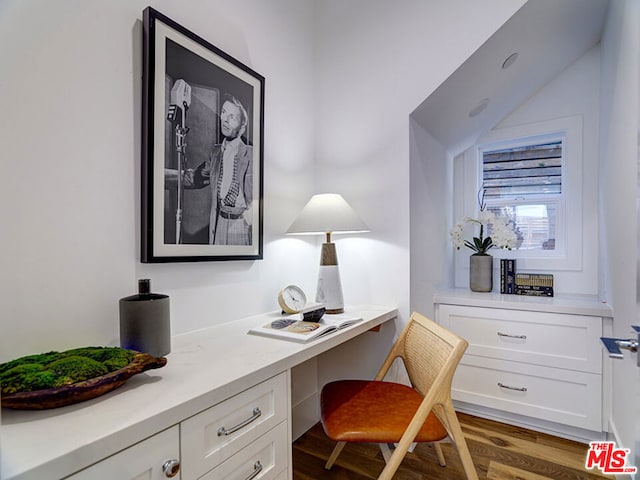 office featuring built in desk and wood-type flooring