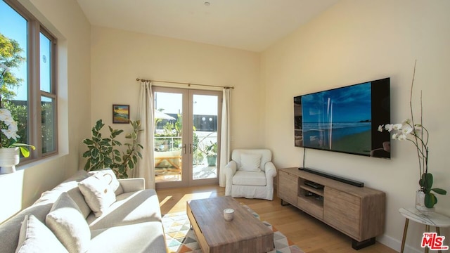 living room featuring light hardwood / wood-style flooring and french doors