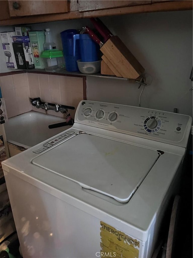 laundry room featuring sink and washer / clothes dryer