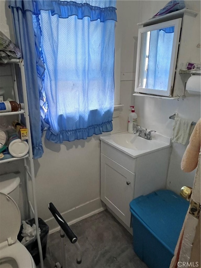 bathroom with toilet and vanity