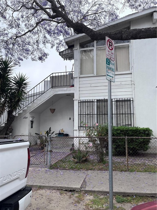 view of home's exterior with a balcony