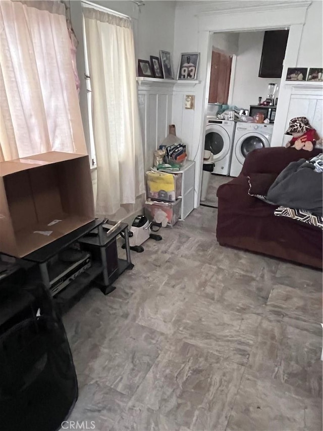 washroom featuring washer and clothes dryer