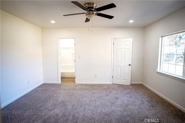 unfurnished bedroom with carpet, ceiling fan, and ensuite bath