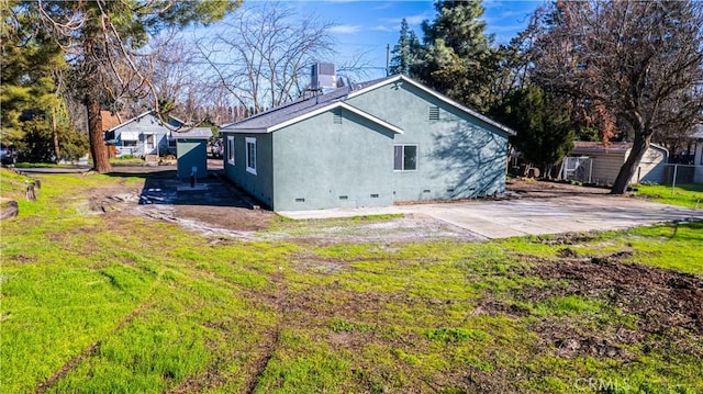 view of property exterior featuring a lawn