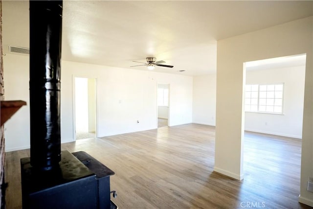 living room featuring hardwood / wood-style flooring and ceiling fan