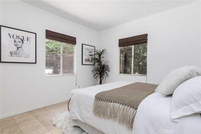 bedroom with light tile patterned flooring