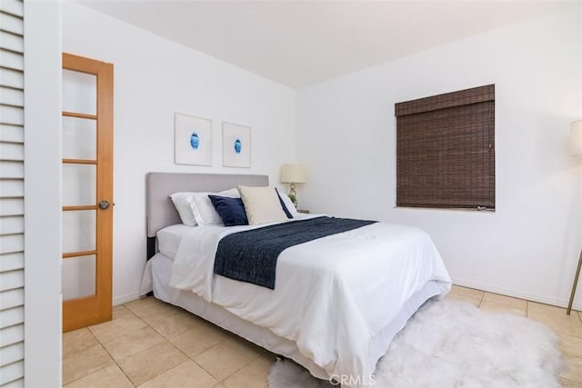 bedroom featuring light tile patterned floors