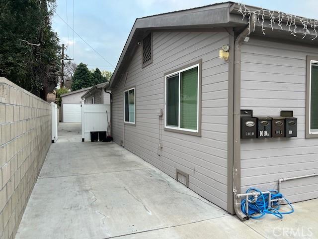 view of property exterior featuring a patio area