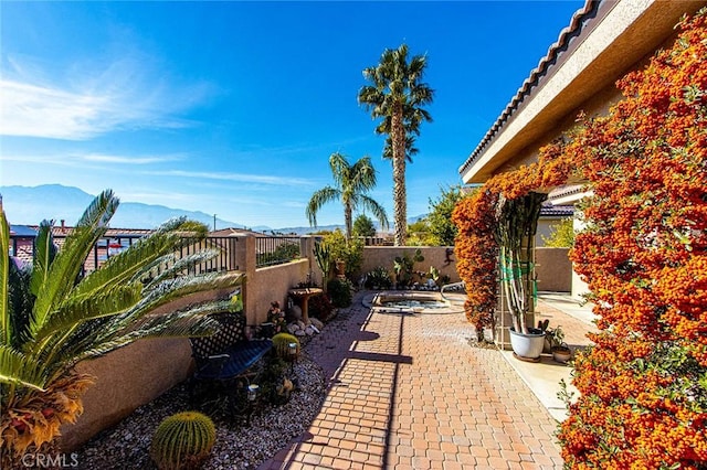 view of patio / terrace featuring a mountain view