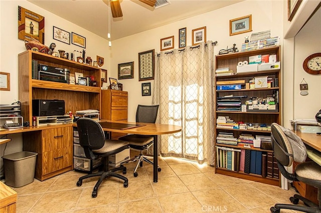 office space featuring ceiling fan and light tile patterned flooring