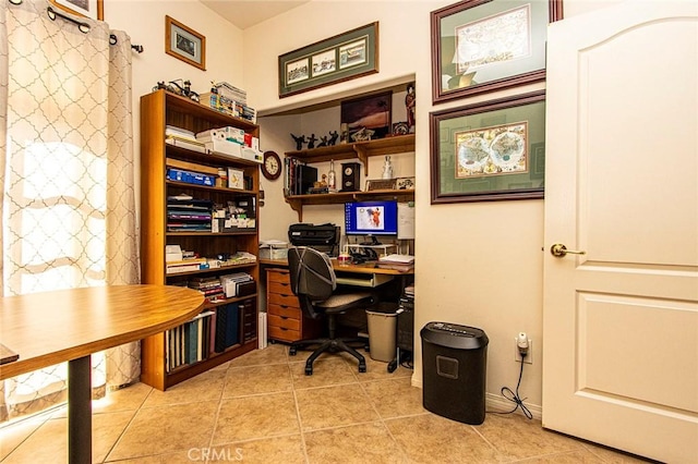 office space with light tile patterned floors