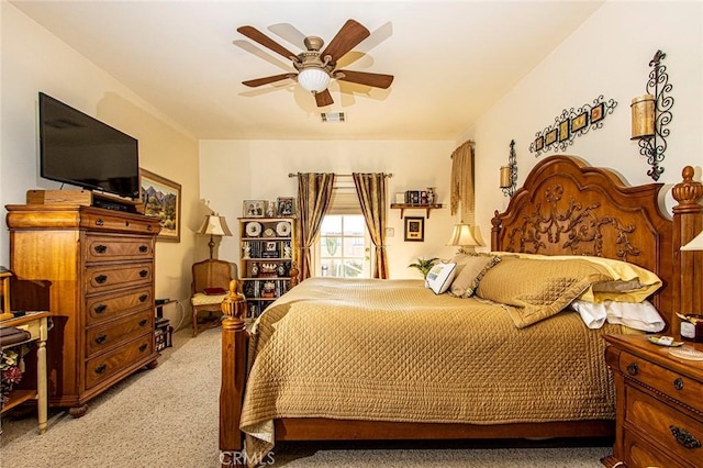 bedroom with ceiling fan and light carpet