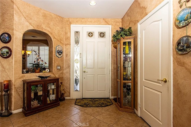 entrance foyer with tile patterned flooring