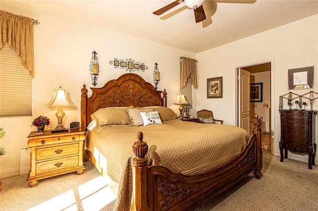 bedroom featuring ensuite bathroom and ceiling fan