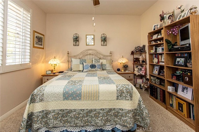 carpeted bedroom with ceiling fan