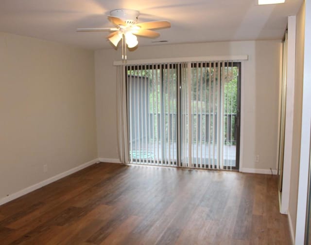 unfurnished room with ceiling fan and dark hardwood / wood-style flooring