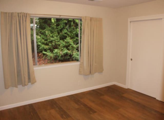 empty room with wood-type flooring