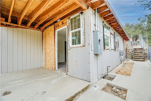 view of side of property with a patio