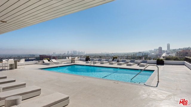 view of swimming pool with a patio