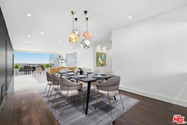 dining area featuring expansive windows and dark wood-type flooring