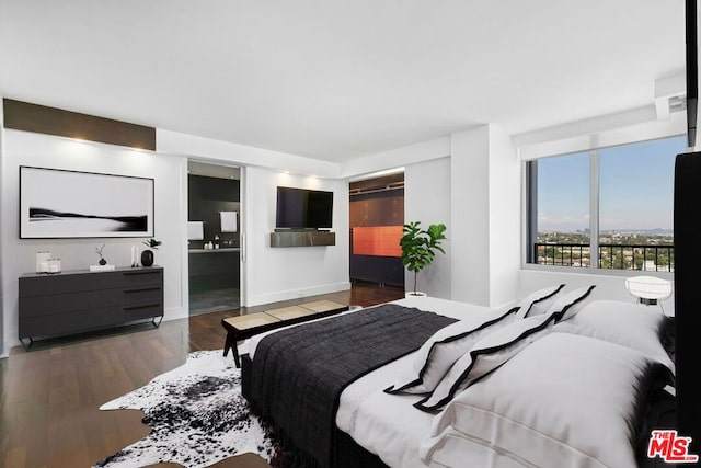 bedroom with dark wood-type flooring