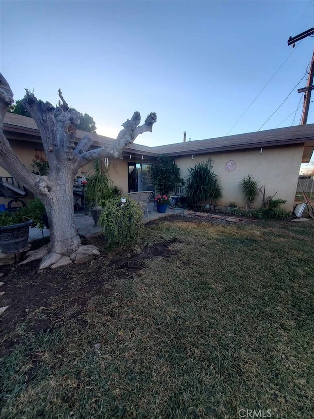 exterior space featuring a yard and a patio