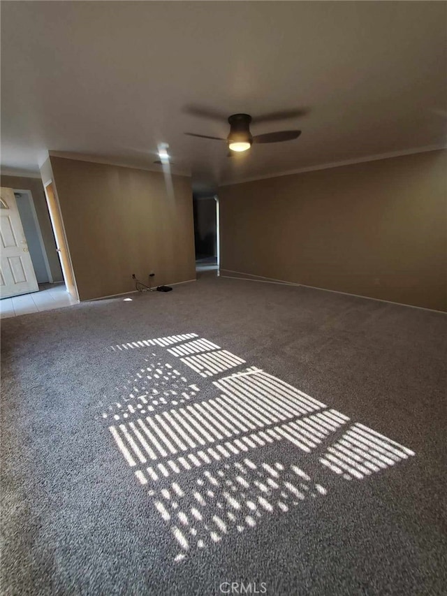 empty room featuring carpet floors and ornamental molding