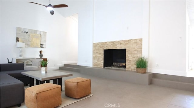 tiled living room with ceiling fan