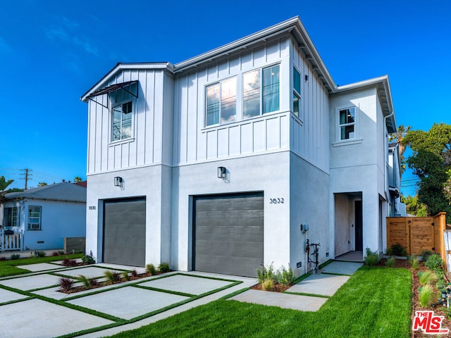 view of front facade with a front yard and a garage