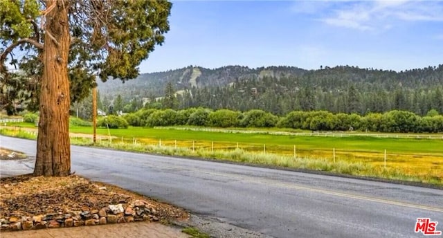 view of road featuring a rural view and a mountain view