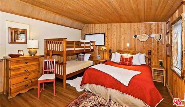 bedroom with vaulted ceiling, wood ceiling, dark hardwood / wood-style floors, and wood walls