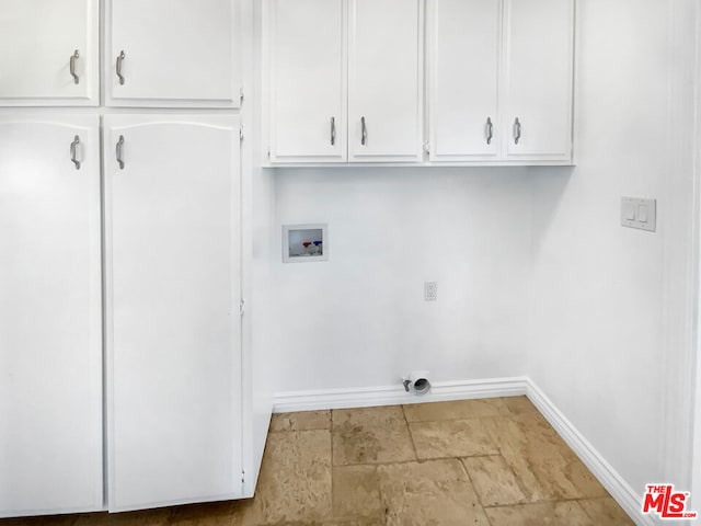 washroom with cabinets, washer hookup, and hookup for an electric dryer