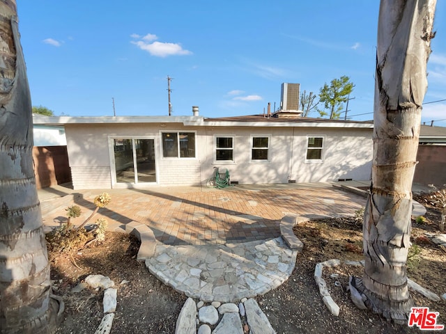 rear view of property featuring a patio