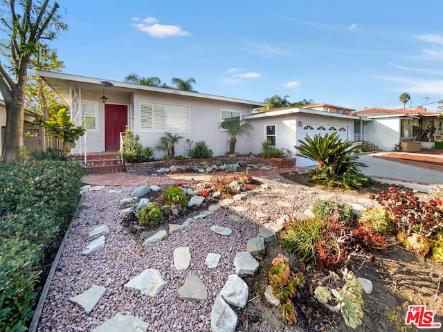 single story home with a garage