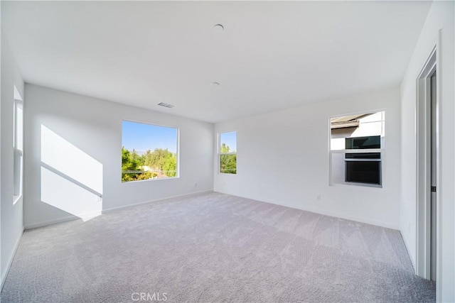 empty room featuring light colored carpet