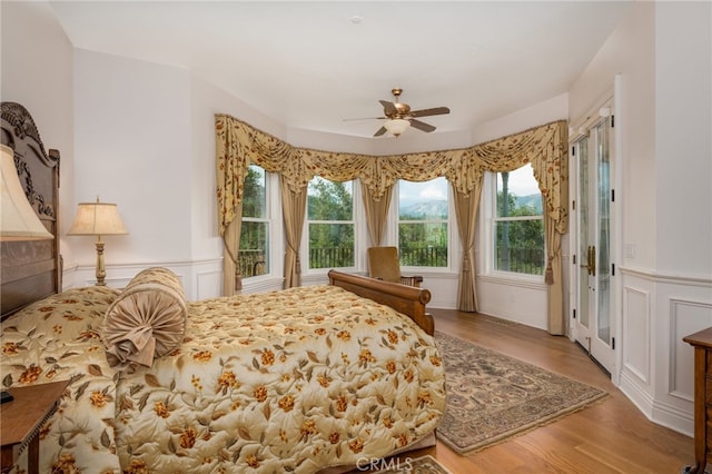 bedroom with ceiling fan and light wood-type flooring