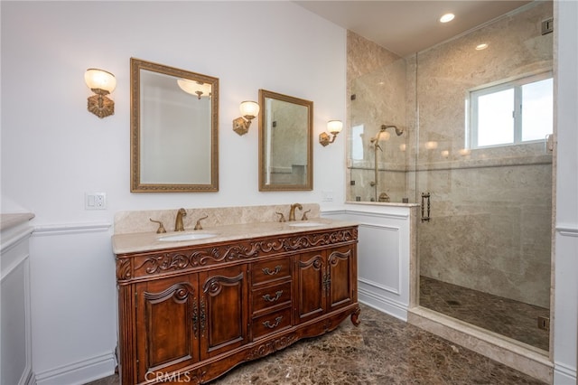 bathroom featuring an enclosed shower and vanity