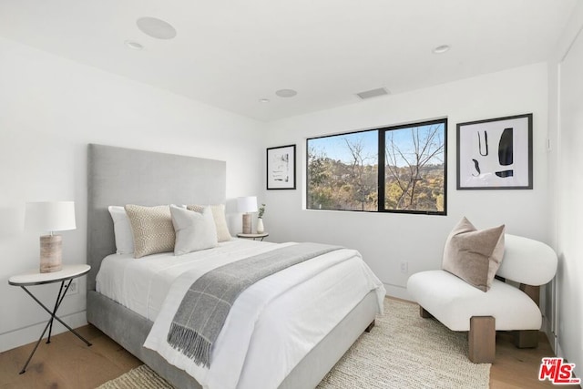 bedroom with light hardwood / wood-style flooring