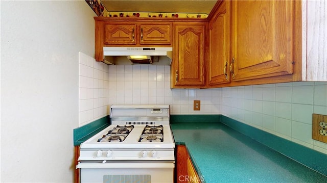 kitchen featuring tasteful backsplash and white gas stove